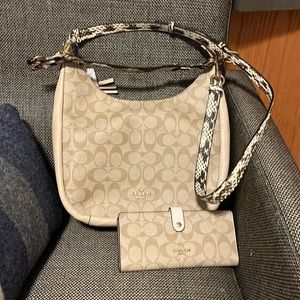 New with tags Coach bag and wallet. Comes with two straps. Vinyl exterior.